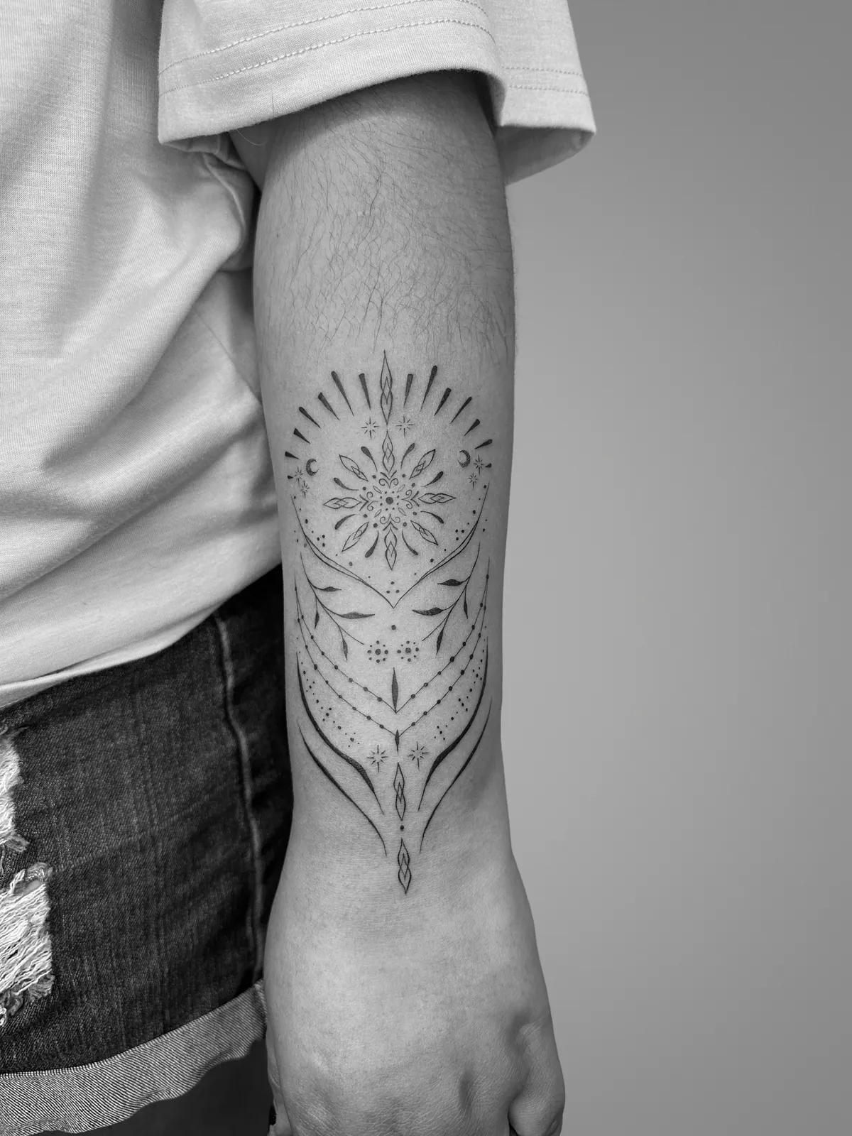 Fine ornamental arm tattoo