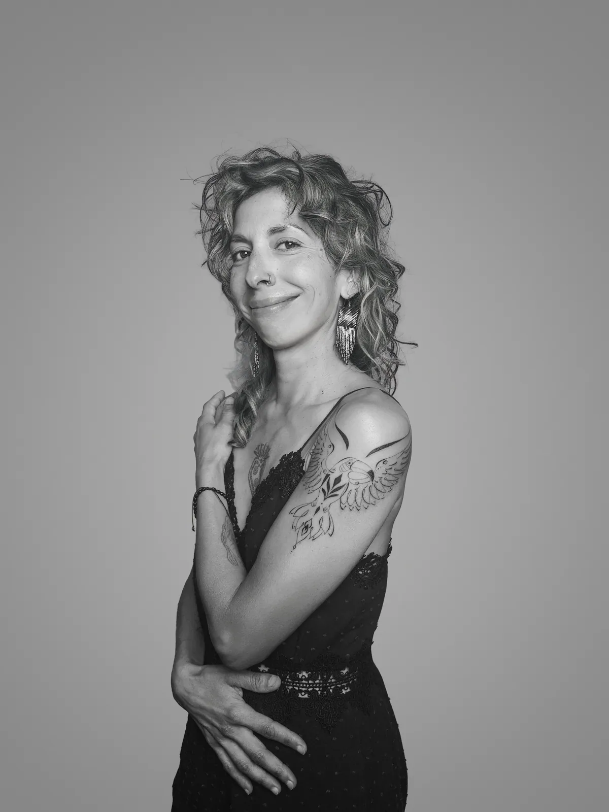 Studio portrait of a woman wearing her tattoos, photograph 11 of 16
