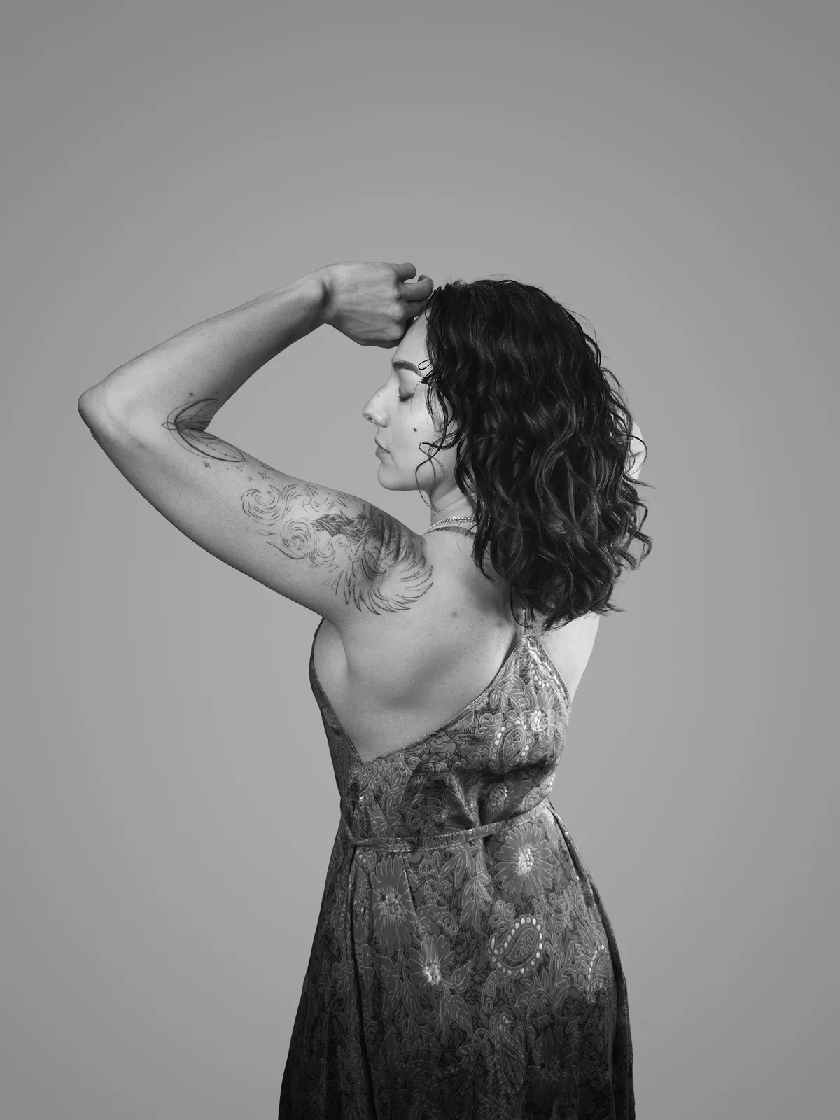 Studio portrait of a woman wearing her tattoos, photograph 2 of 16