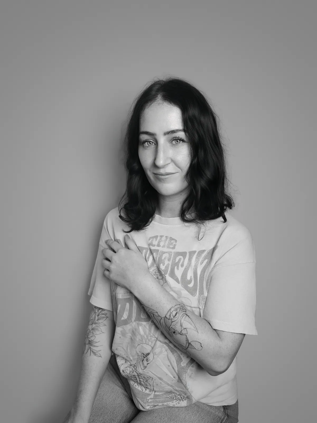 Studio portrait of a woman wearing her tattoos, photograph 13 of 16
