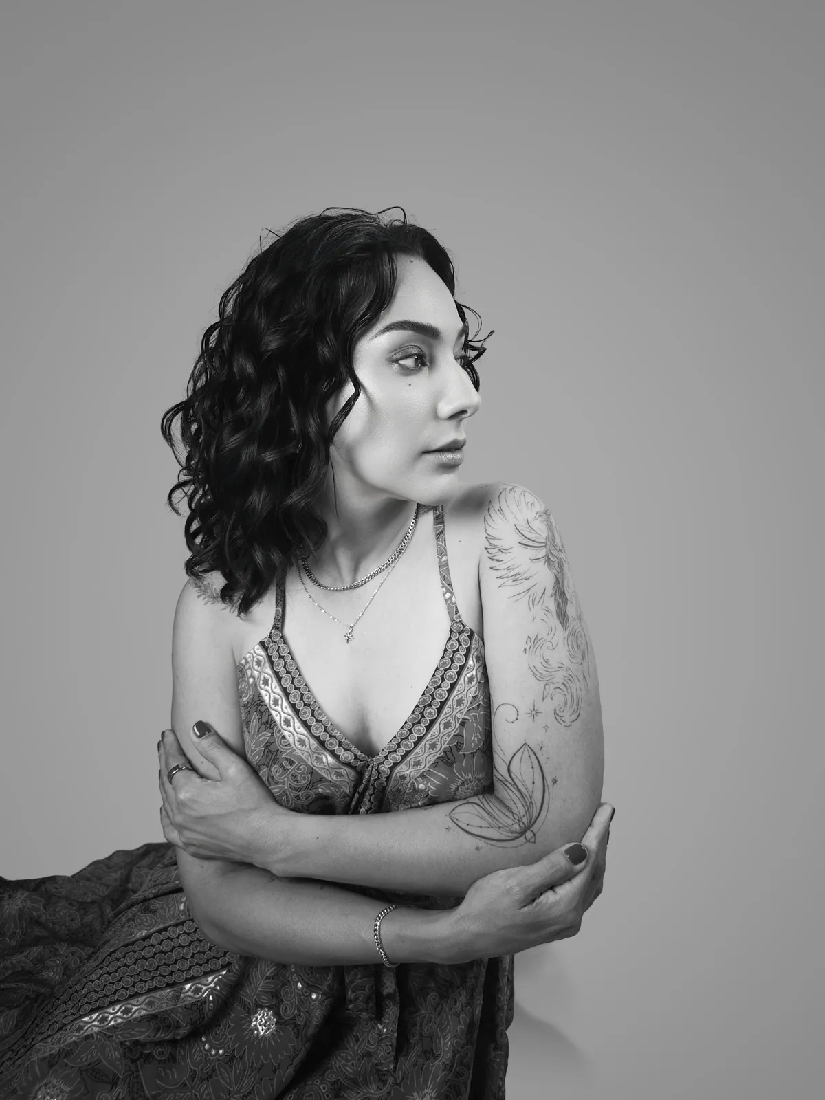 Studio portrait of a woman wearing her tattoos, photograph 3 of 16