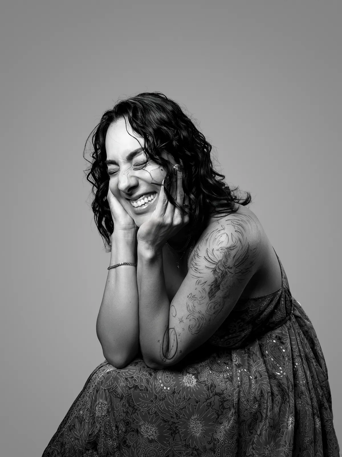Studio portrait of a woman wearing her tattoos, photograph 1 of 16
